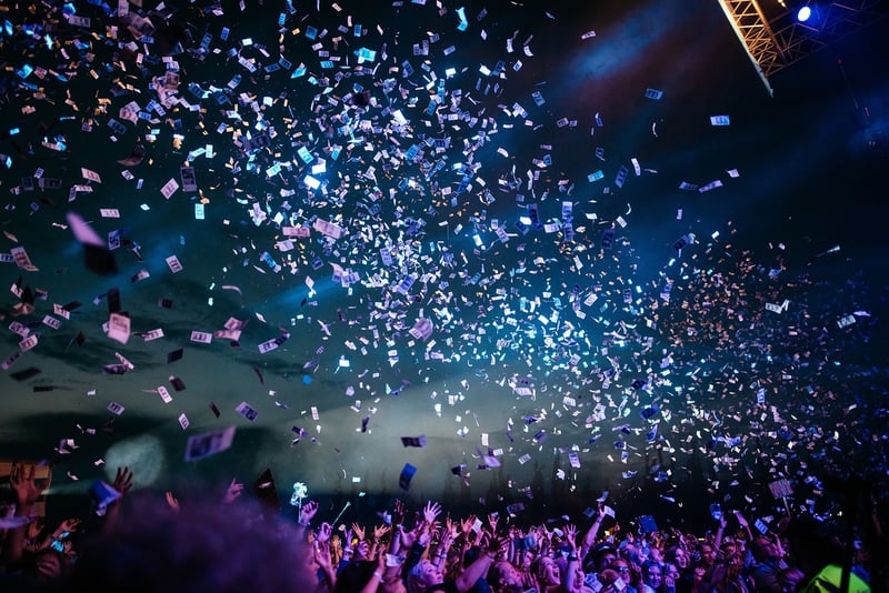 Concert crowd with hands raised